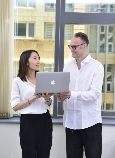 Corrado and Nina working on a computer